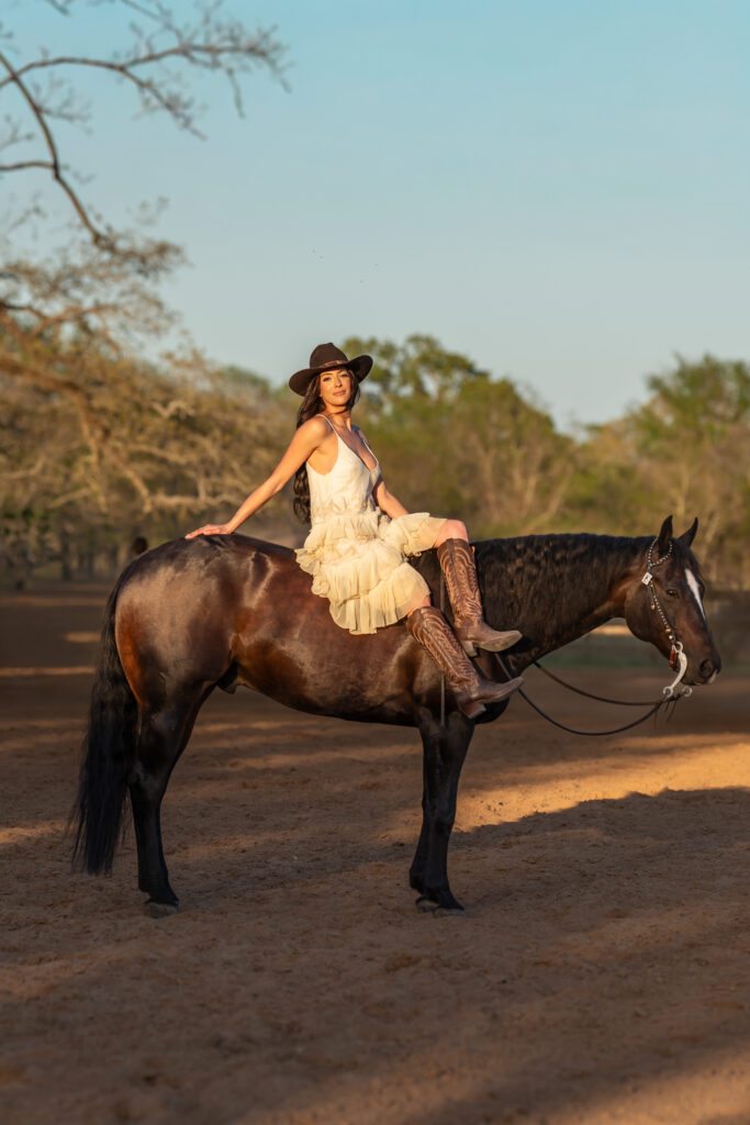 Woman sitting on top of her horse